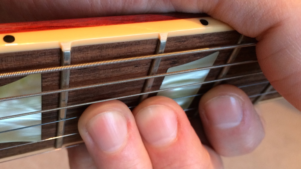 reduce fret buzz